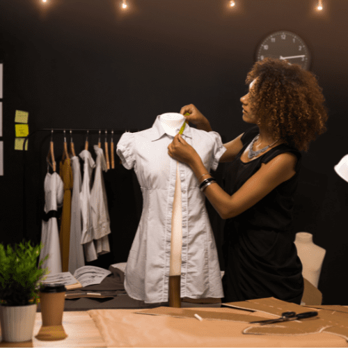 A woman working on a mannequin at Safi Marketplace.