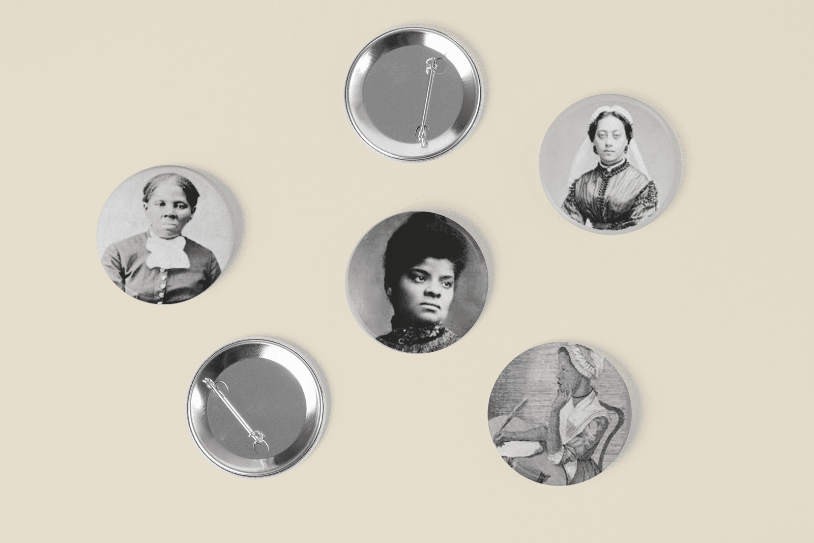 Five black and white photos of women on a buttons including trailblazers Ida B. Wells and Harriet Tubman.